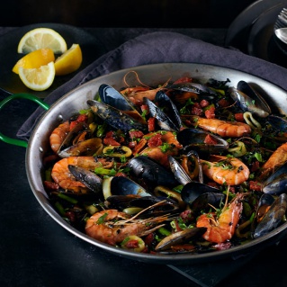 Black rice paella with seafood